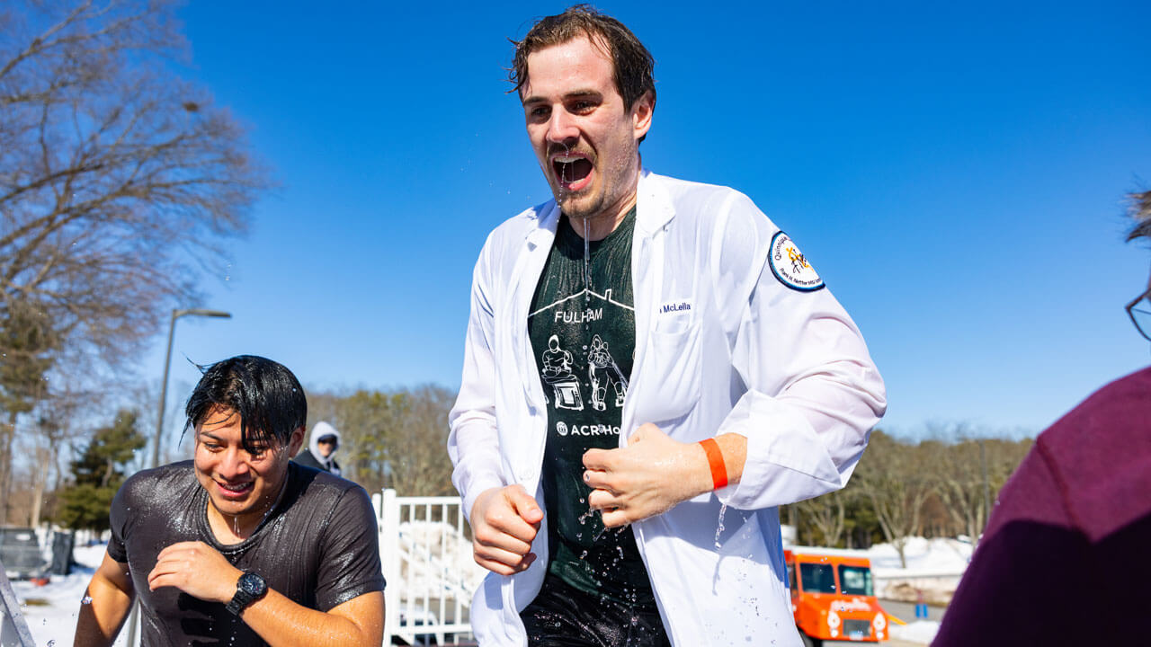 Students come out of dunk tank in the freezing cold