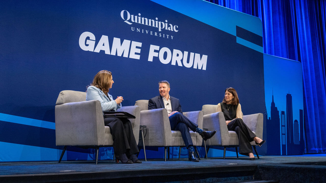 The game forum stage with moderator Dean Holly Raider and guests