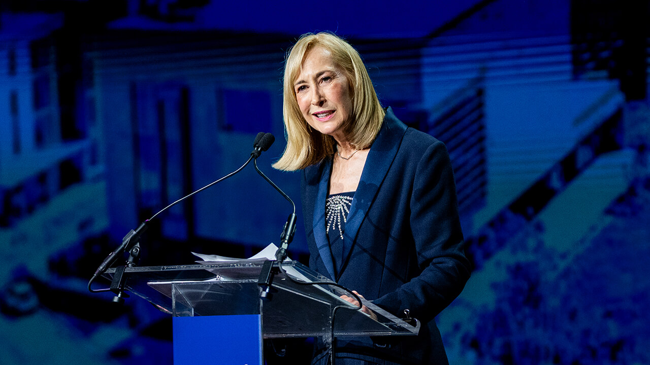 President Marie Hardin speaking at the podium at Quinnipiac Gala