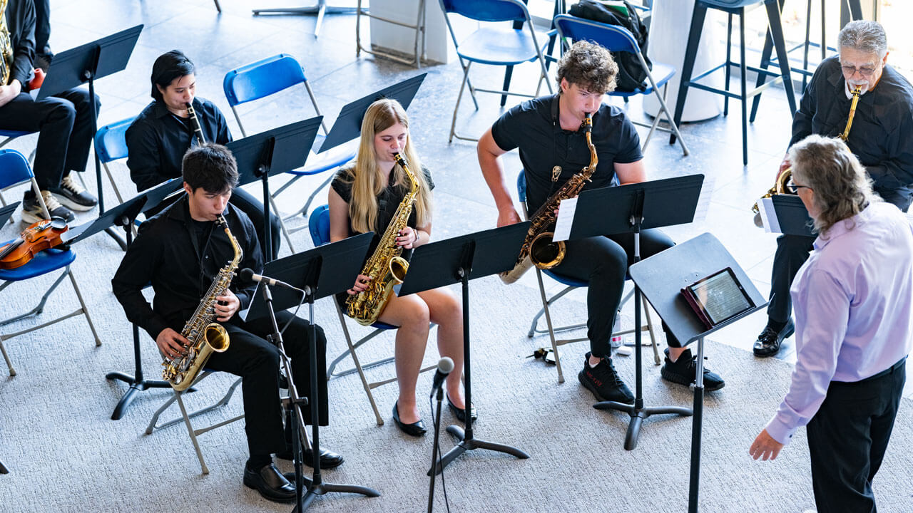 Students play in a band at Illuminate event.