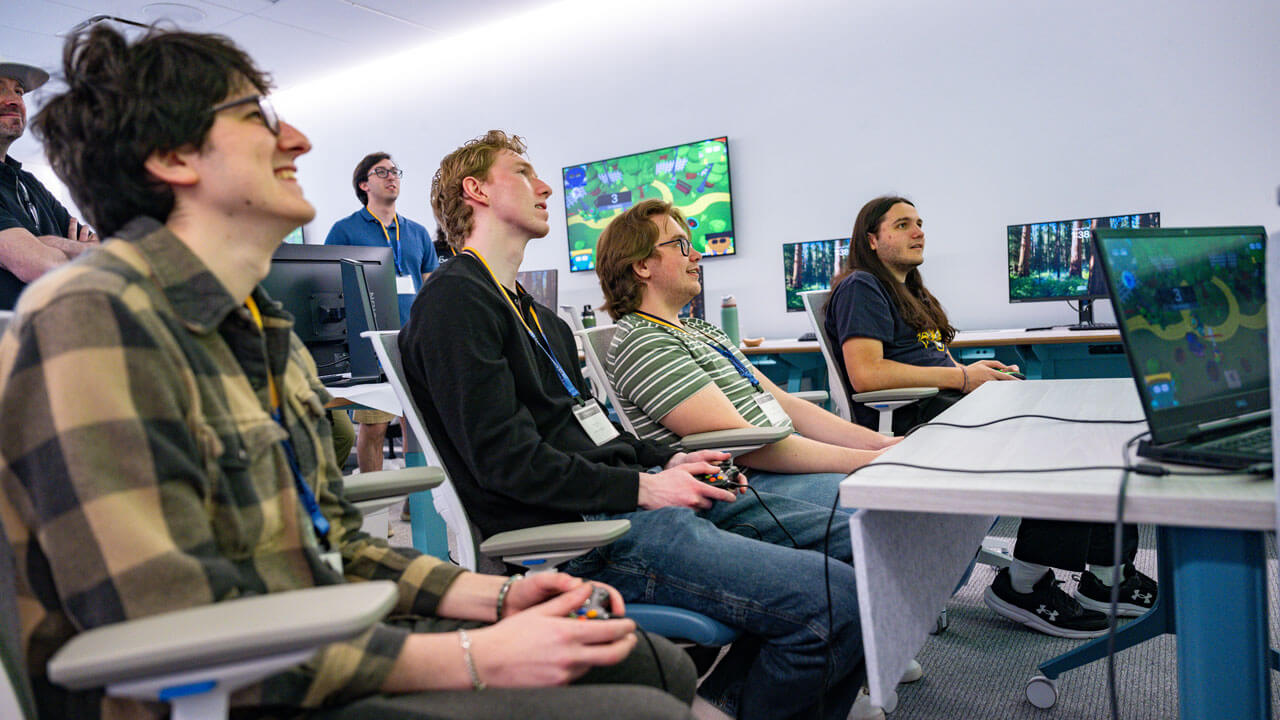 Several students play the game a fellow classmate created