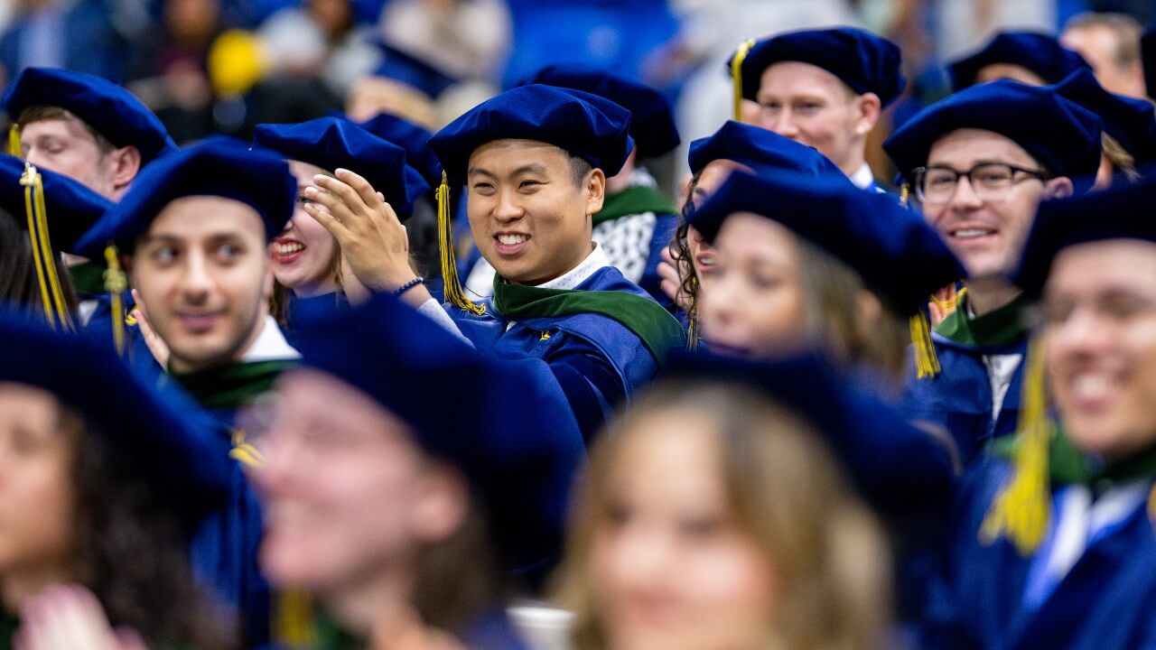 Graduates clapping during the ceremony
