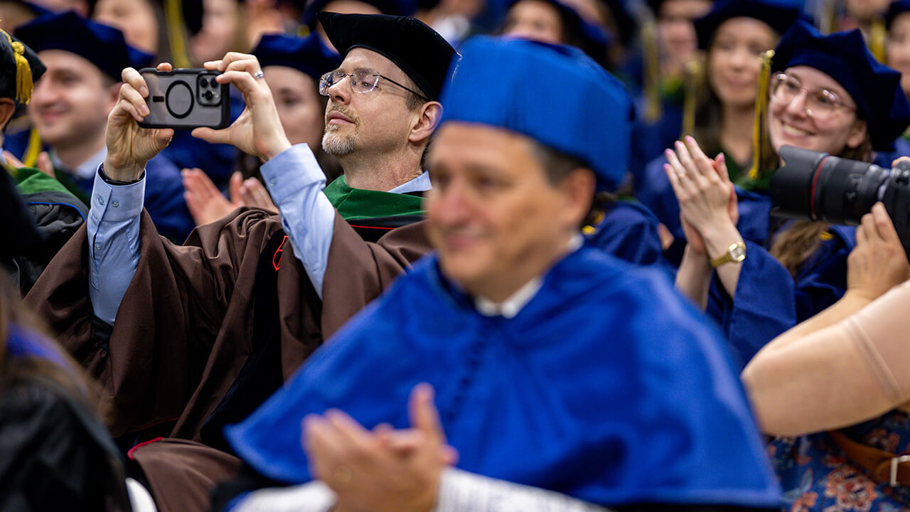 Facility wear caps and gown in celebration of medical student graduates