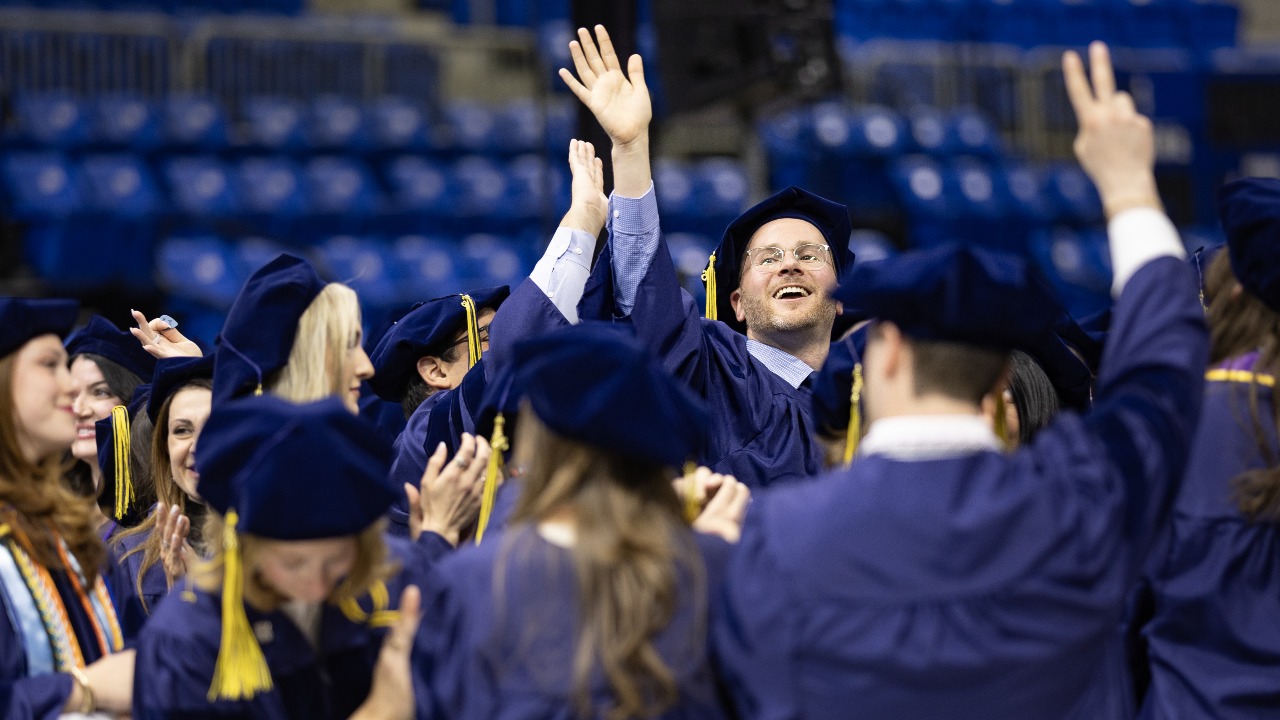 Grads put their hands in the air