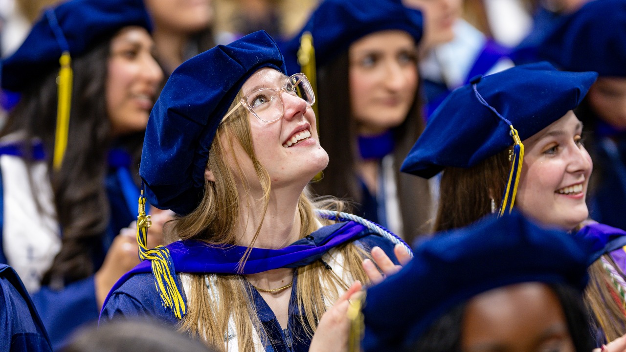 Graduating student looks up