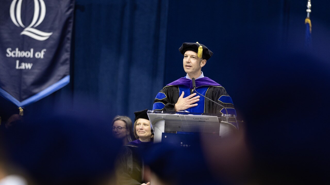 Dean Brian Gallini speaking at the podium