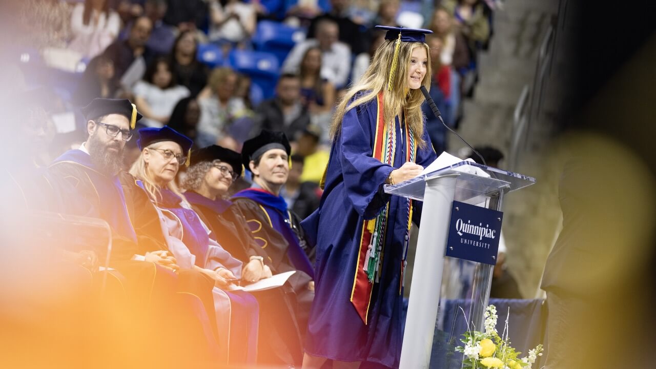 Class speaker speaks at the podium