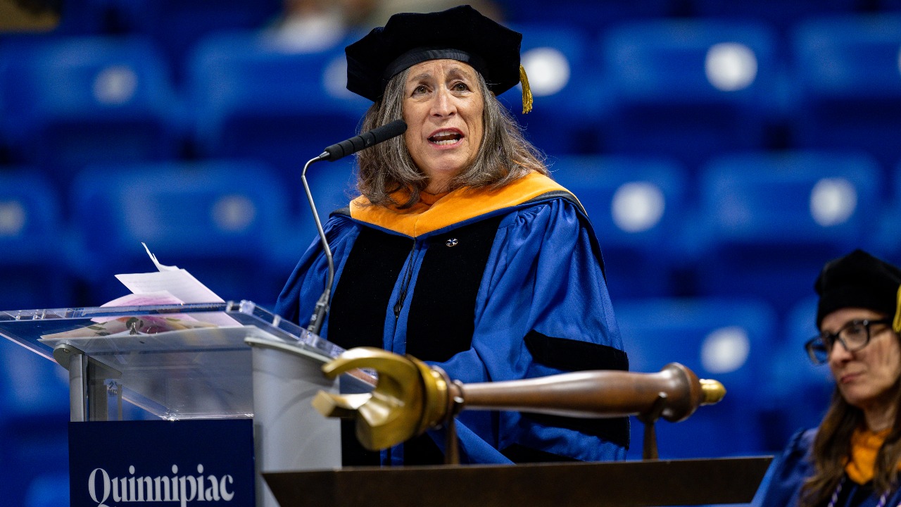 Chief Mutate Mutahash Marilynn Malerba address graduations from the podium