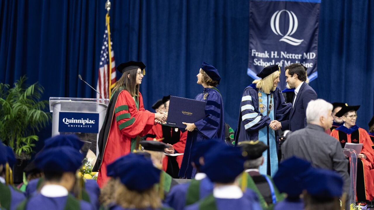 President Hardin and Dean Lisa Coplit shaking hands at Commencement