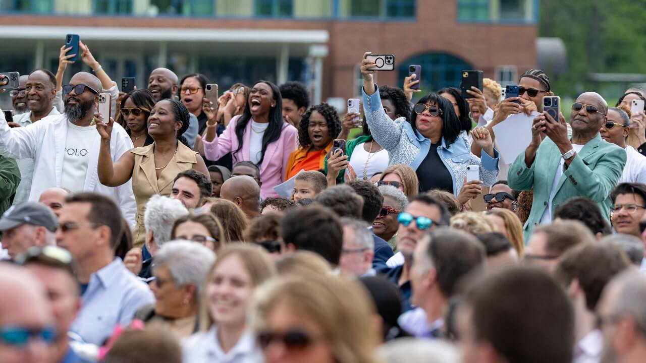 Crowd cheers for their graduates.