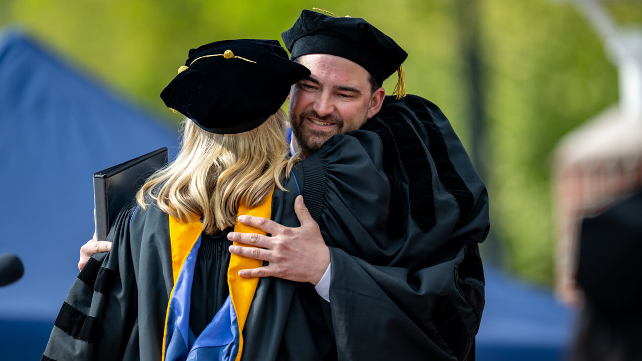 Sara MacDonough-Civitello and Mike Papale embrace