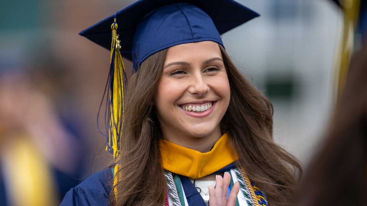 Graduate smiling and looking slightly to the right