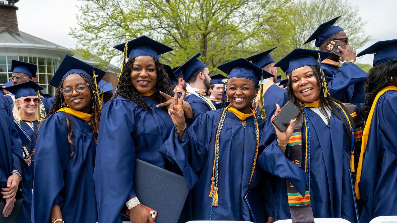 Graduates cheering in the crowd during their commencement ceremony