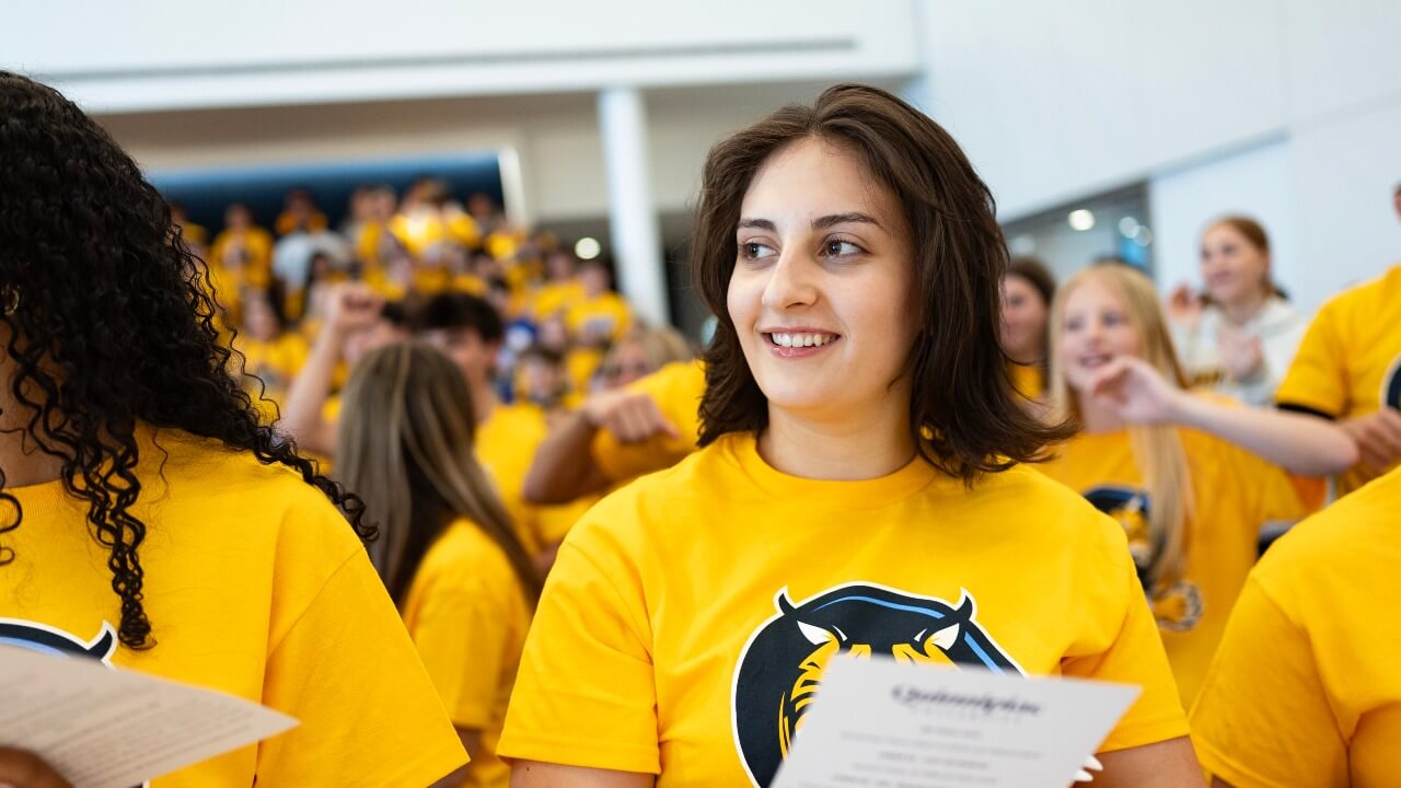 Student smiling during closing ceremony