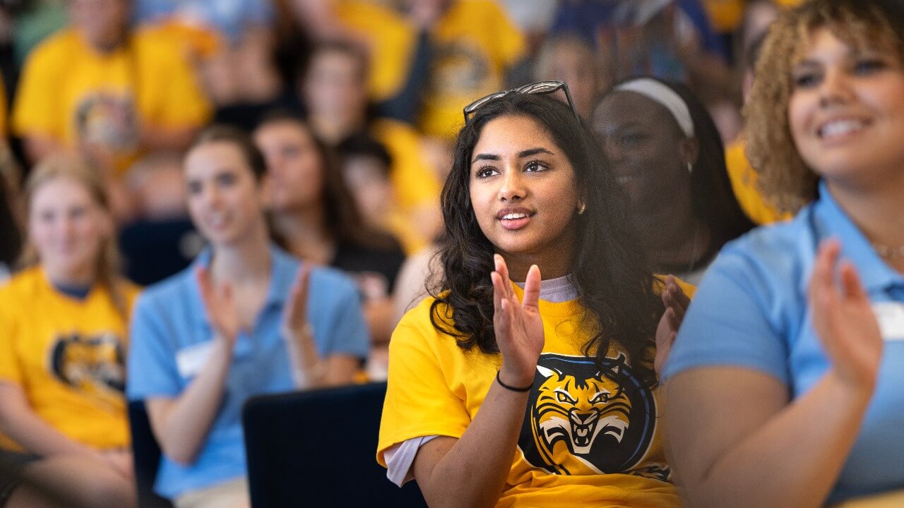 Students clapping during Orientation closing ceremony