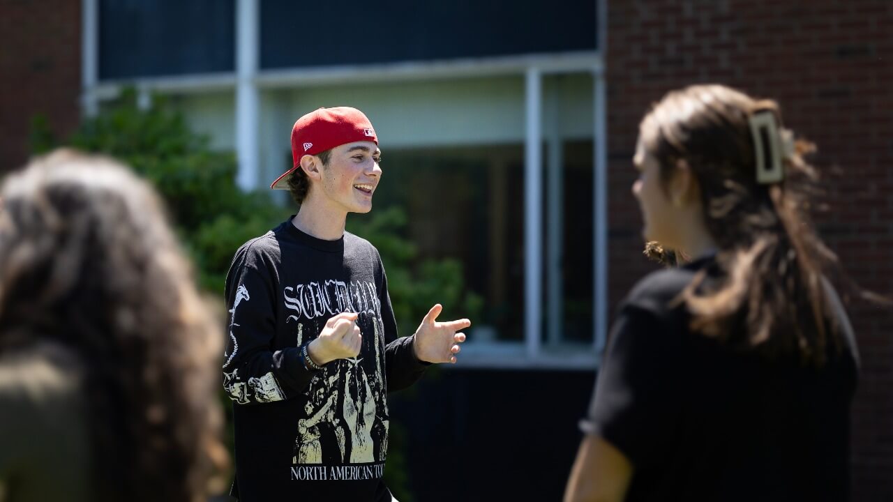 Student talking to a peer