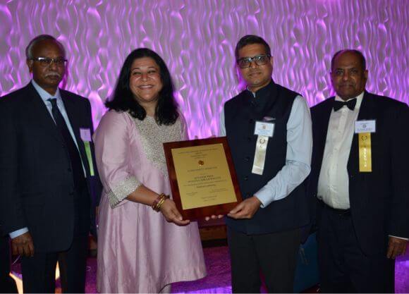 Professor Sujata Gadkar-Wilcox receiving an award