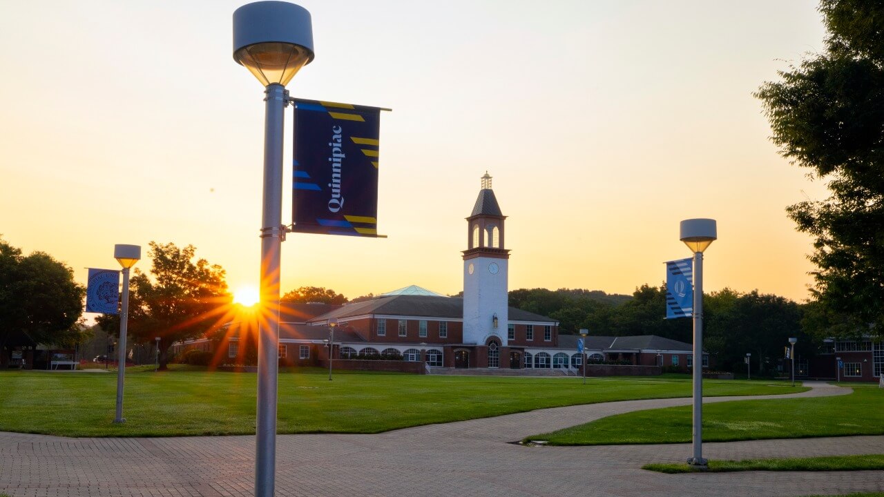 Sunrise behind the Arnold Bernhard Library