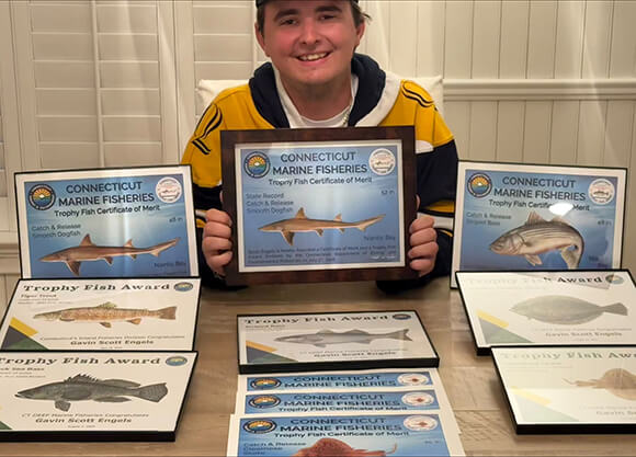 Gavin Engels '29 with multiple fishing awards.