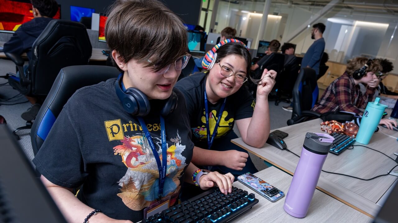 Two students collaborating at computer