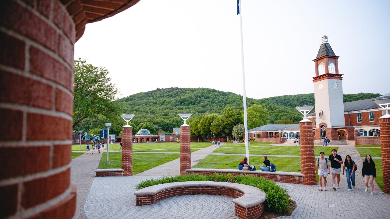 Students walking across the Mount Carmel Quad