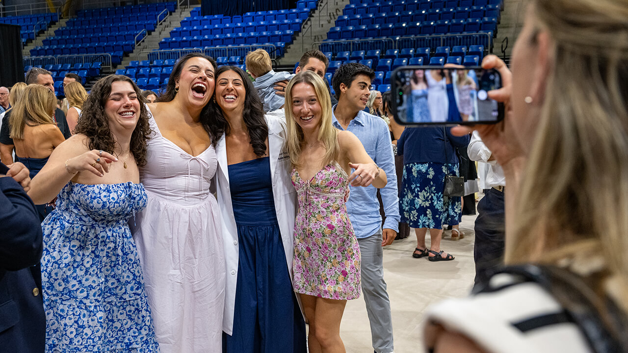 Students smiling together for a group photo
