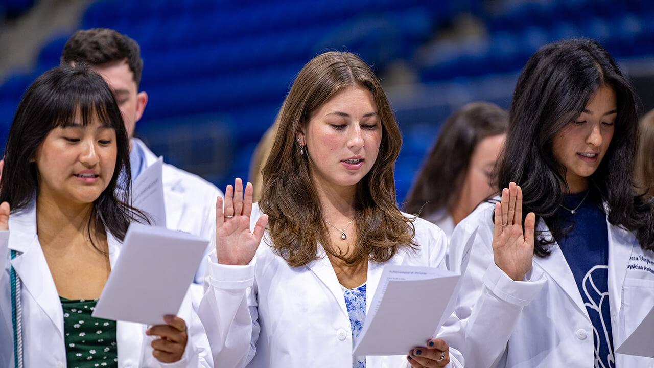 Students taking an oath