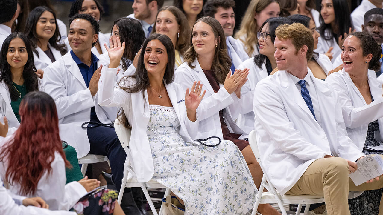 Students waving to their families