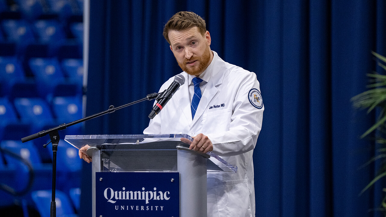 Person speaking at the podium