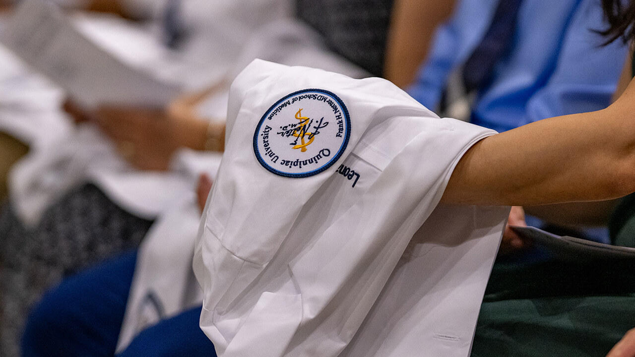 Embroidery of the white coat sleeve