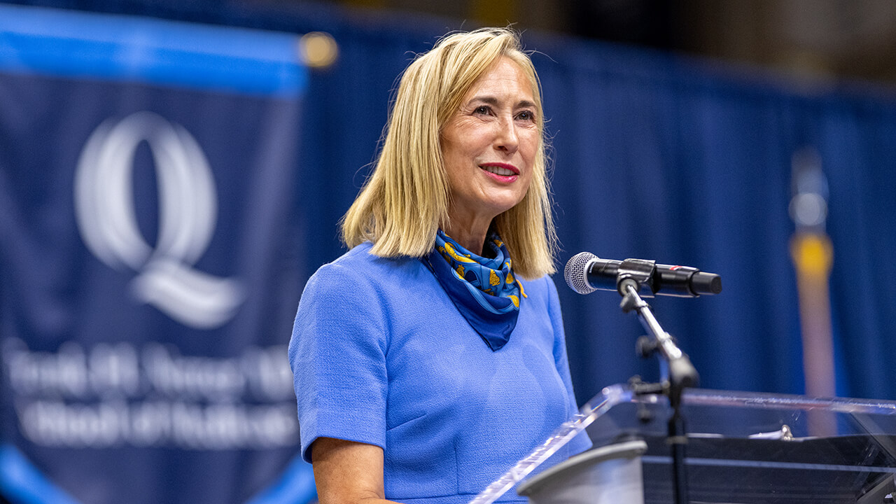 President Marie Hardin speaking at the podium