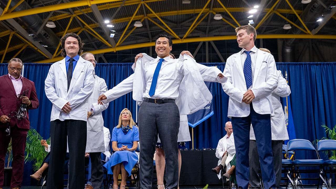 Students presented with their white coats